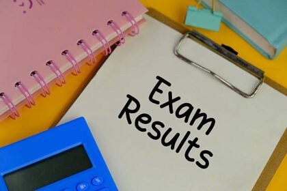EXAM RESULT on white pad with exam tools on yellow background